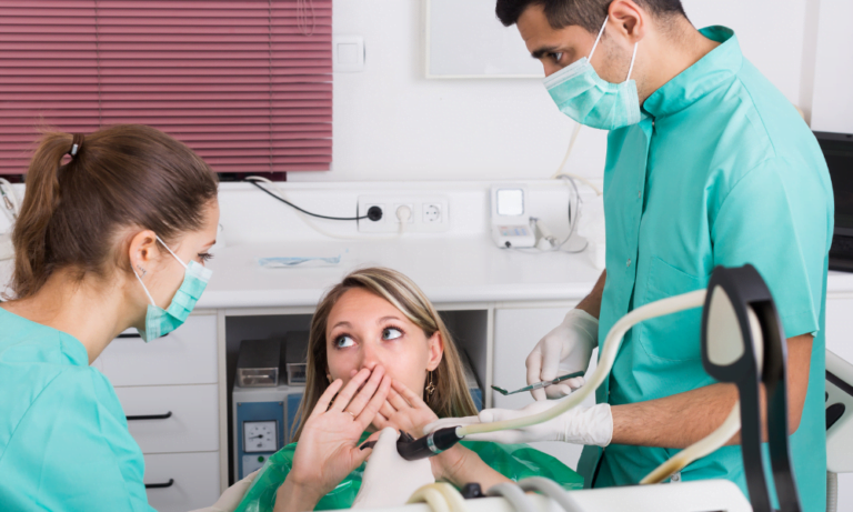 Female patient being seen by her dentist