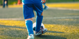 Young child playing soccer