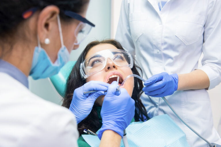 Female patient sitting in the dentists chair.