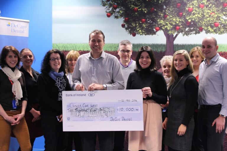 DeCare team pictured presenting a check for €10,000 to cancer care west