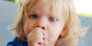 Young child sucking their thumb