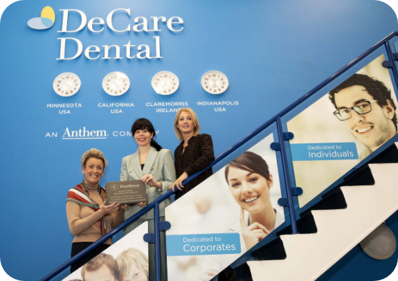 dental wall with smiling team