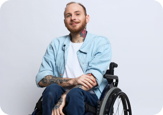 man smiling in wheelchair